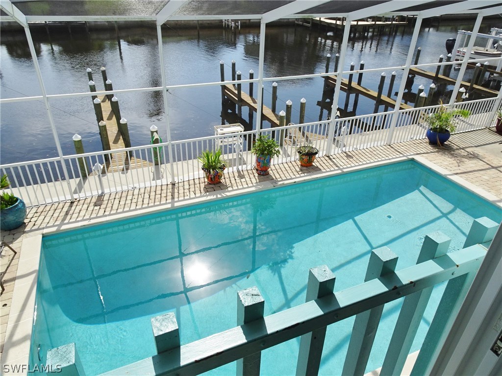 3215 Stringfellow Road, Unit 201 St. James City, FL 33956 - Photo 16 of 25 a view of entryway and hall with wooden floor