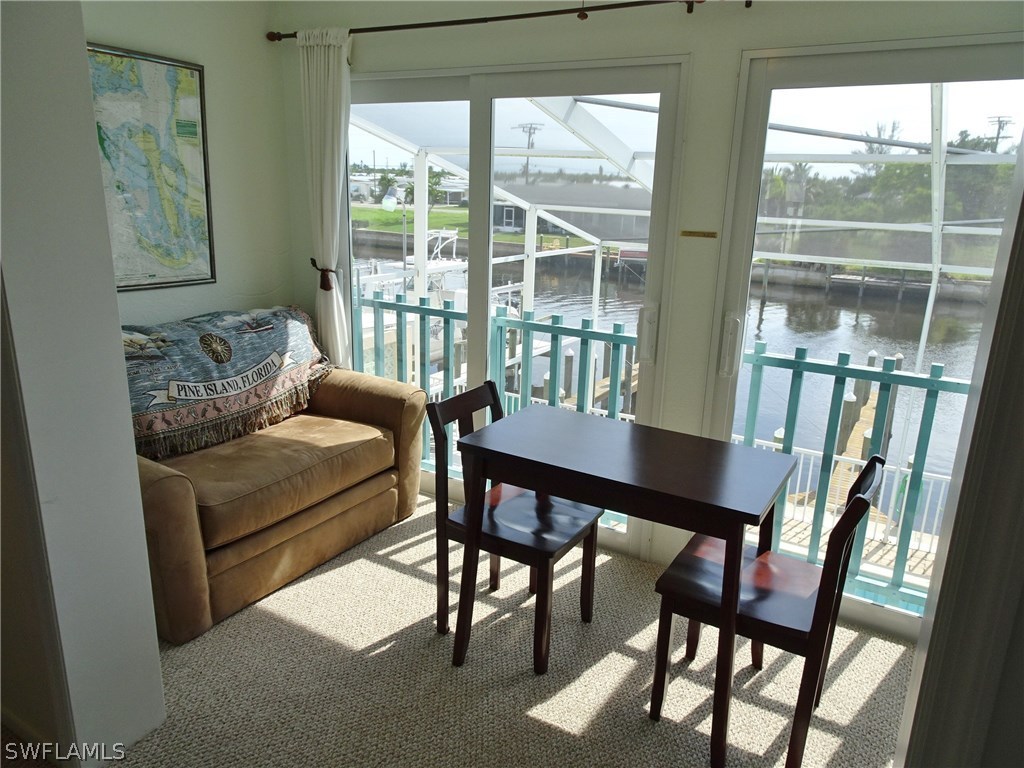 3215 Stringfellow Road, Unit 201 St. James City, FL 33956 - Photo 3 of 25 a living room with furniture and a window