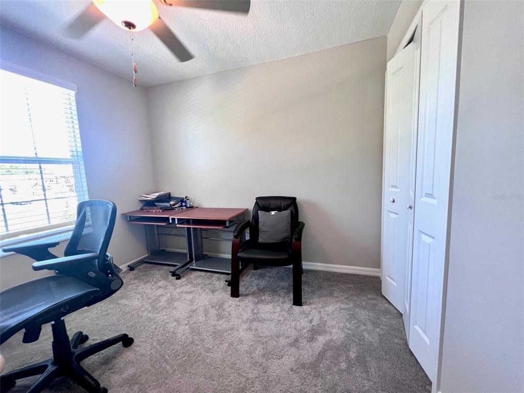 2170 Shining Azul Way Lutz, FL 33558 - Photo 12 of 16 a view of a workspace with furniture and a window