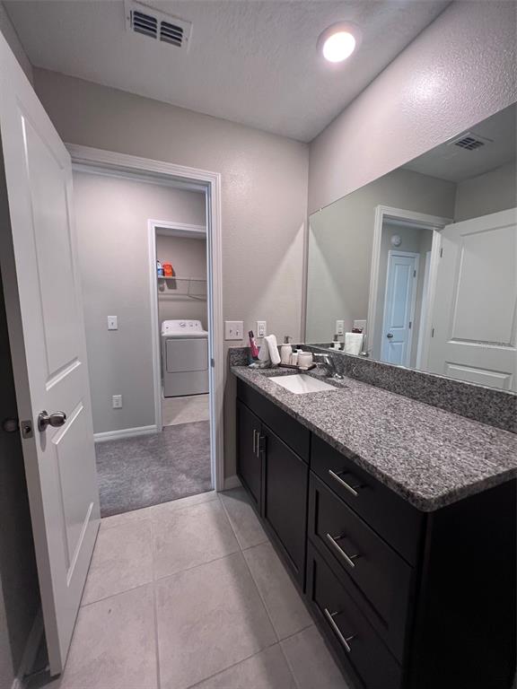 2170 Shining Azul Way Lutz, FL 33558 - Photo 9 of 16 a bathroom with a granite countertop sink and a mirror