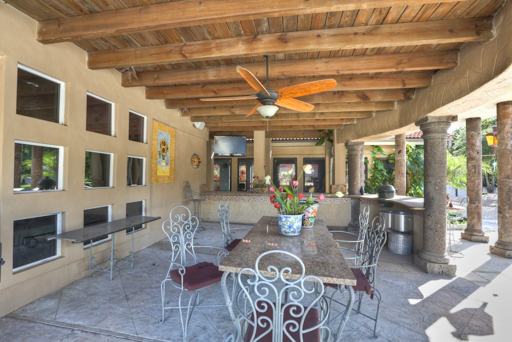 614 Pine Gully Road, Unit LOFT Seabrook, TX 77586 - Photo 18 of 29 a dining room with furniture a chandelier and wooden floor