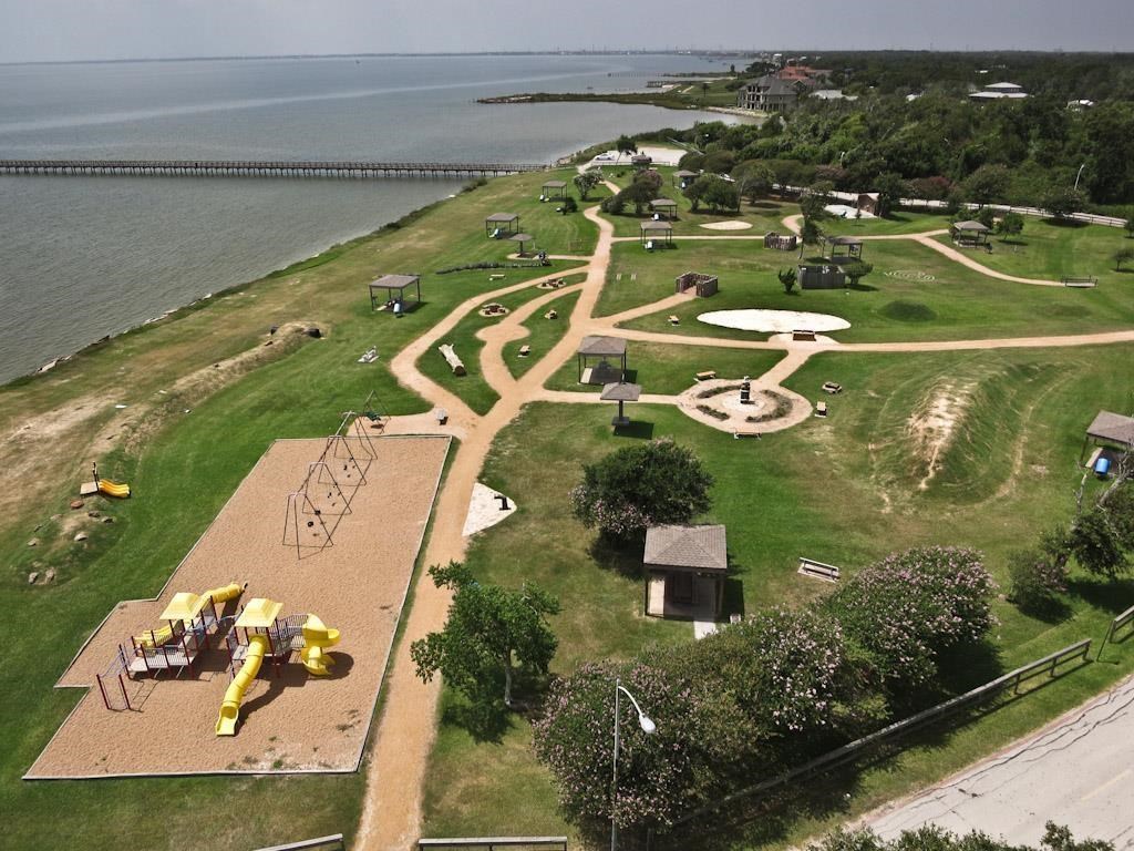 614 Pine Gully Road, Unit LOFT Seabrook, TX 77586 - Photo 20 of 29 an aerial view of a house with a yard basket ball court and outdoor seating