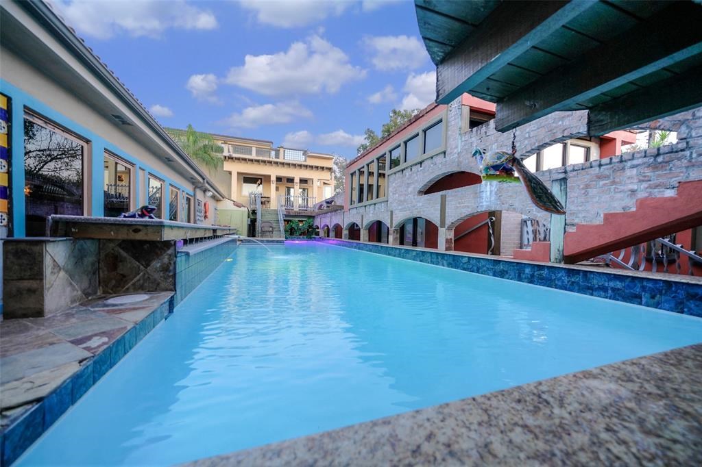 614 Pine Gully Road, Unit LOFT Seabrook, TX 77586 - Photo 21 of 29 a view of swimming pool with outdoor seating