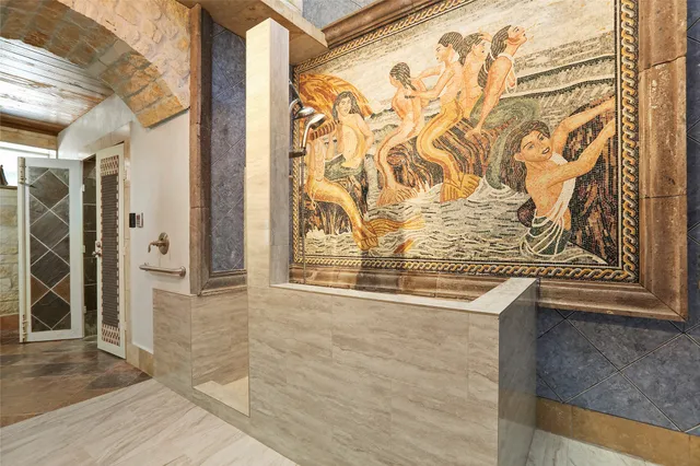 a bathroom with a bathtub and shower