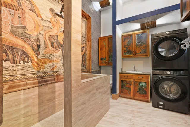 a view of a storage & utility room with washer and dryer