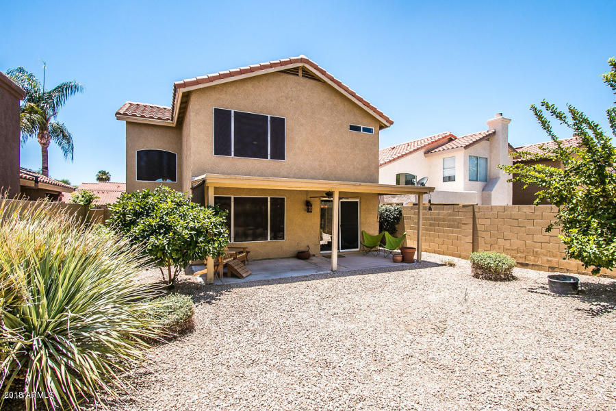 4632 East Danbury Road Phoenix, AZ 85032 - Photo 3 of 9 a front view of a house with a yard