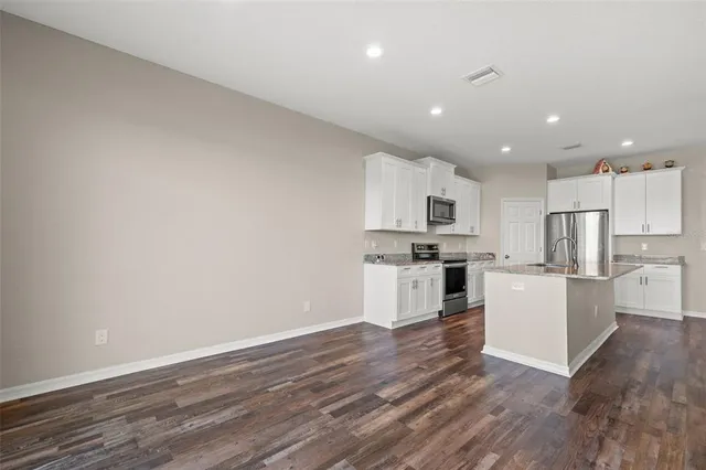 a view of kitchen with wooden floor