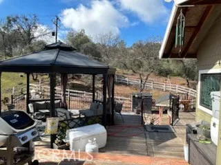 a backyard of a house with outdoor seating