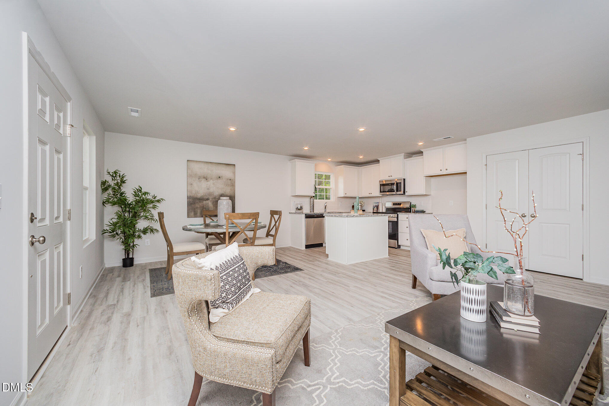 272 Johnson Rdg Way, Unit 1 Four Oaks, NC 27524 - Photo 10 of 27 a living room with furniture kitchen and a potted plant