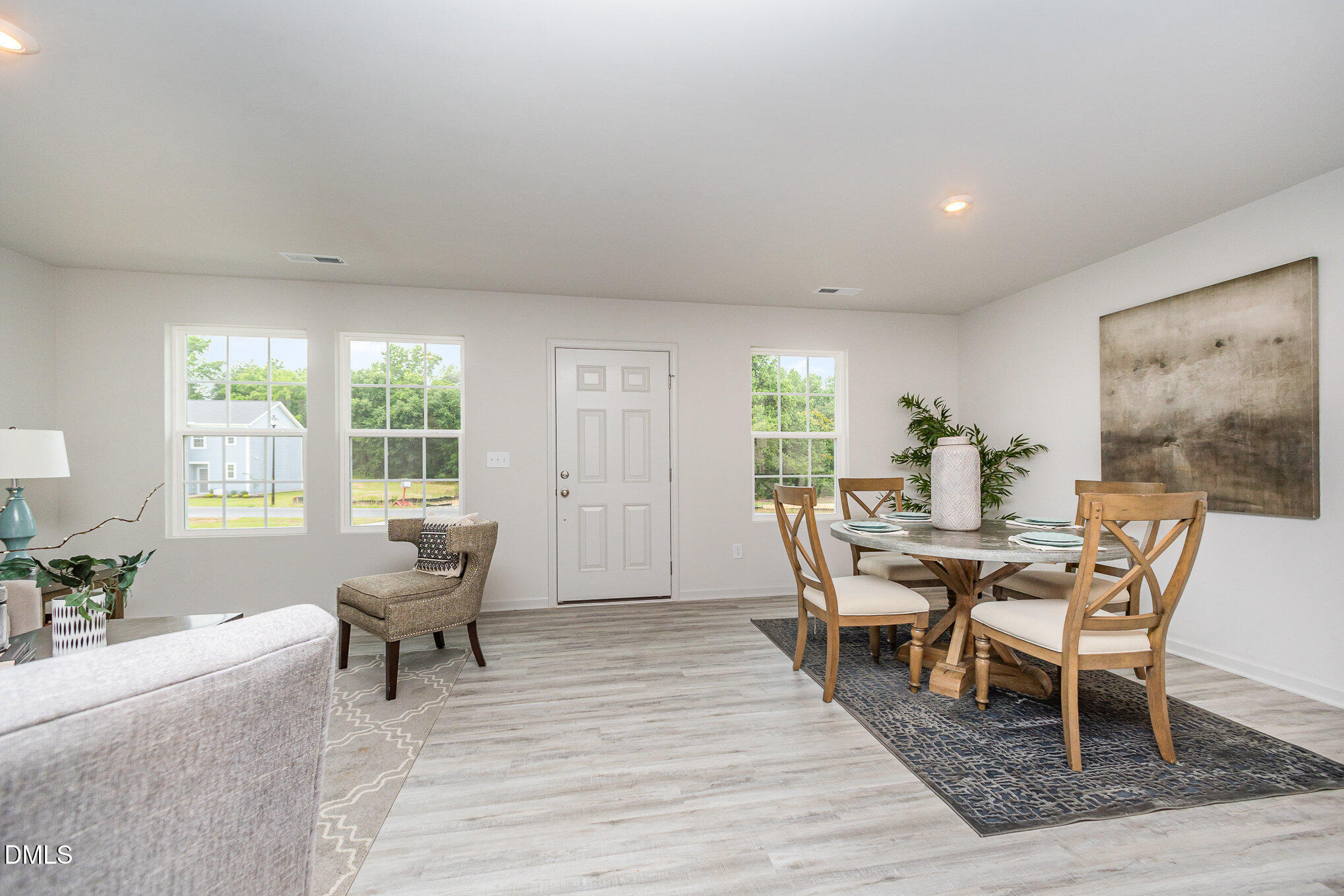 272 Johnson Rdg Way, Unit 1 Four Oaks, NC 27524 - Photo 12 of 27 a dining room with furniture and wooden floor
