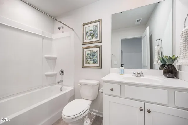 a bathroom with a sink a toilet and a bathtub