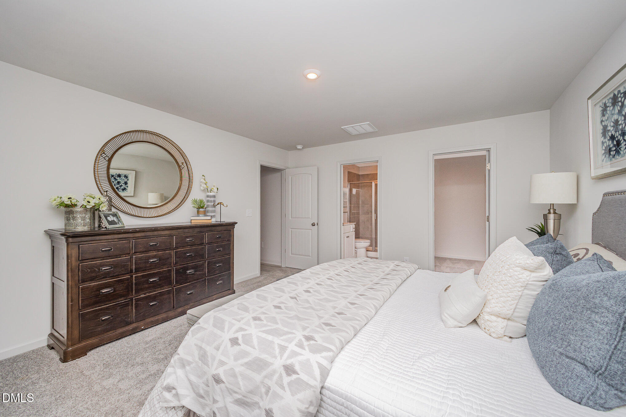 272 Johnson Rdg Way, Unit 1 Four Oaks, NC 27524 - Photo 19 of 27 a bedroom with a bed and a dresser