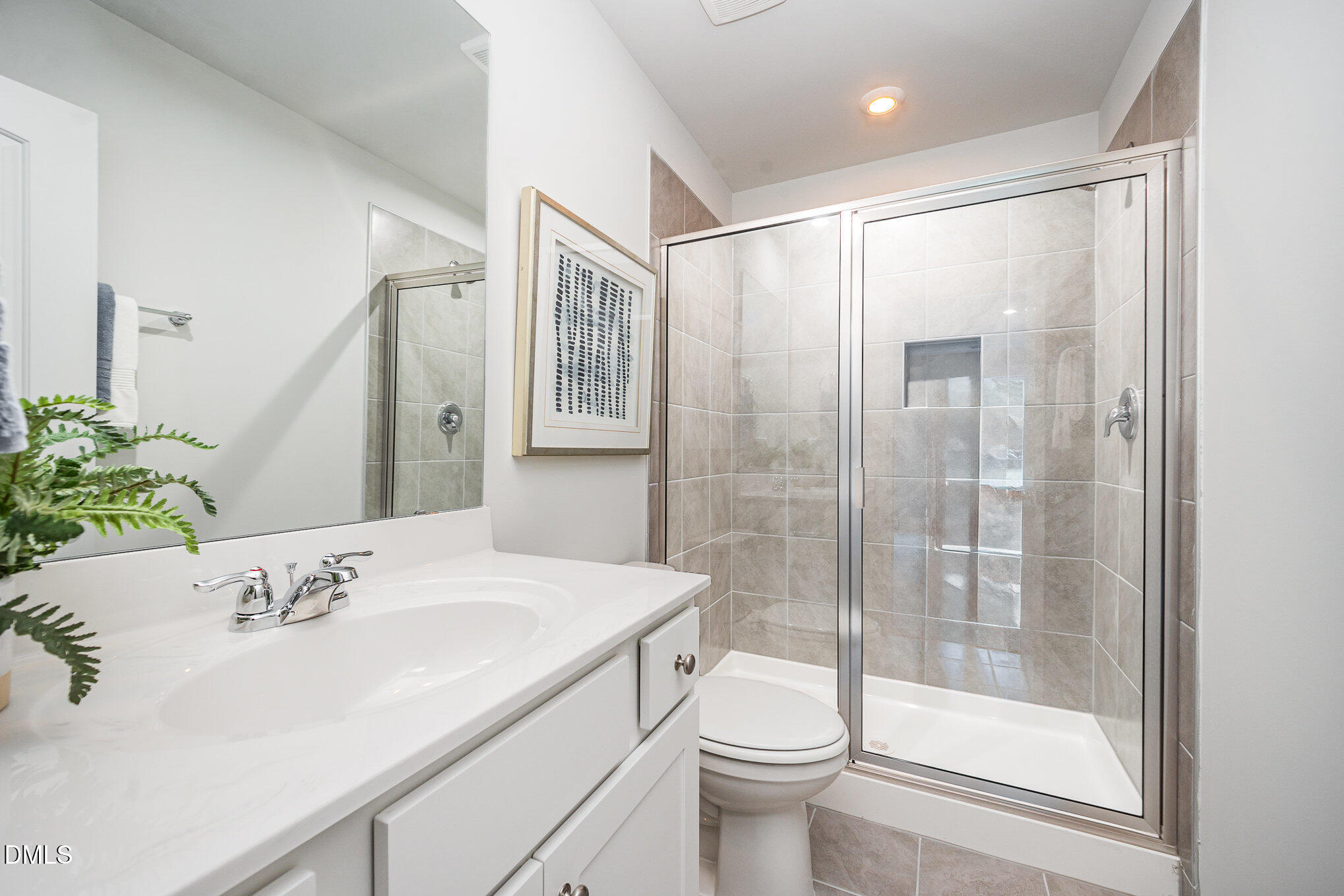 272 Johnson Rdg Way, Unit 1 Four Oaks, NC 27524 - Photo 21 of 27 a bathroom with a sink toilet and shower