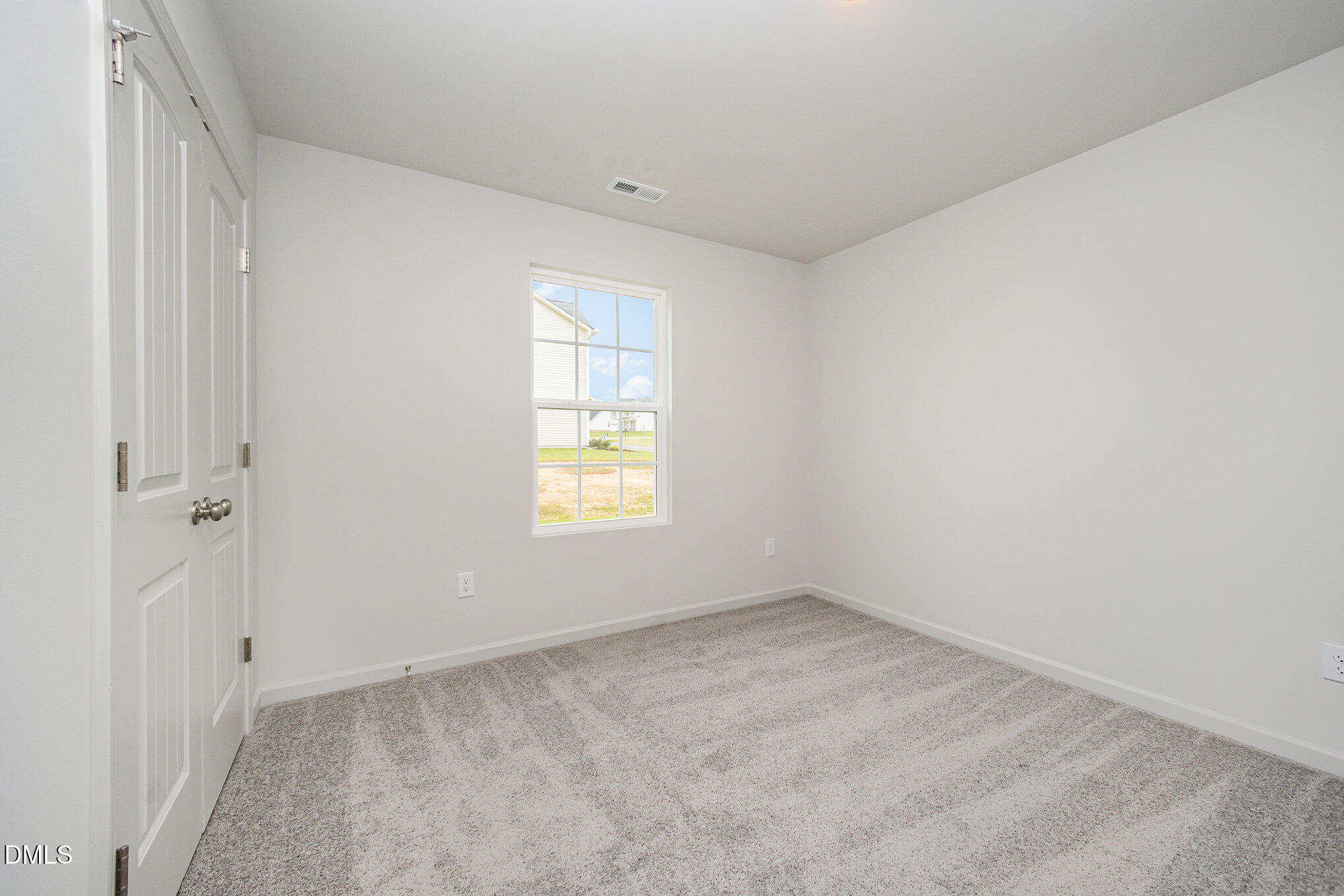 272 Johnson Rdg Way, Unit 1 Four Oaks, NC 27524 - Photo 22 of 27 an empty room with a window