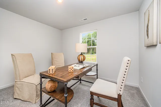 a view of a workspace with furniture