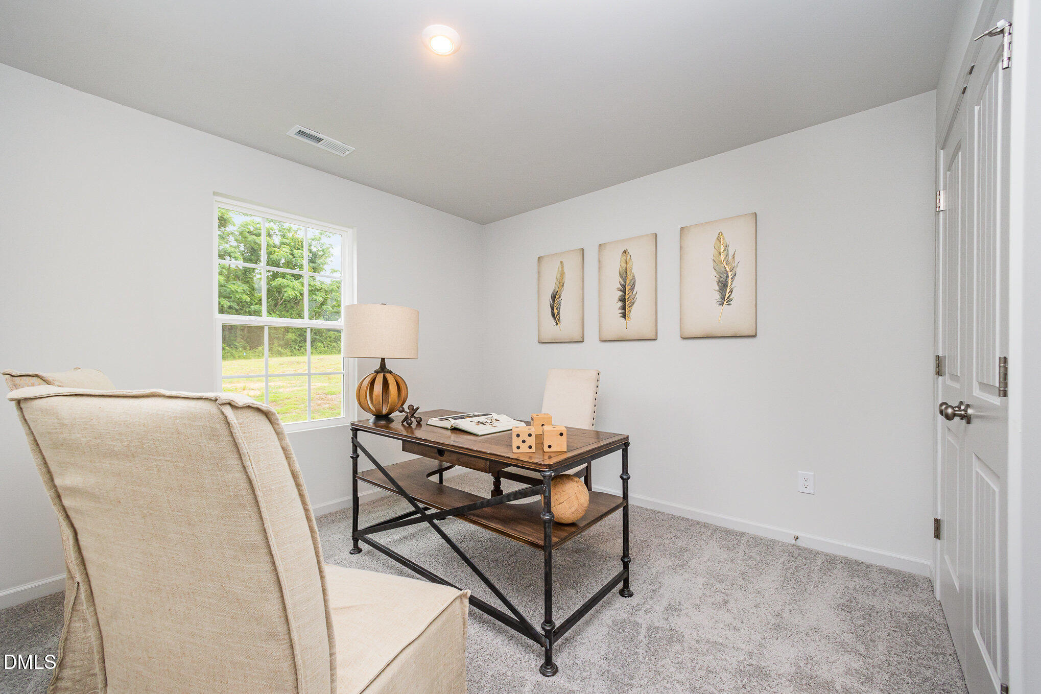 272 Johnson Rdg Way, Unit 1 Four Oaks, NC 27524 - Photo 25 of 27 a living room with furniture and a window