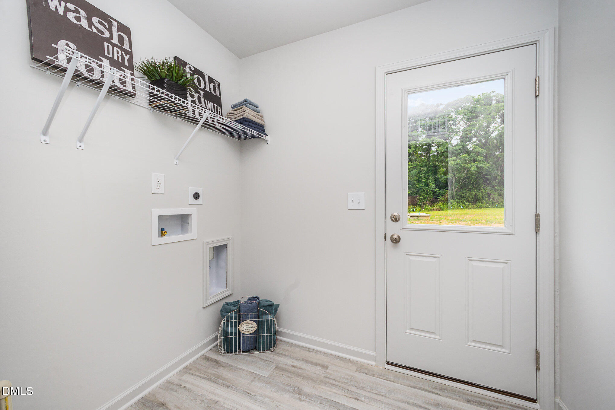 272 Johnson Rdg Way, Unit 1 Four Oaks, NC 27524 - Photo 26 of 27 a view of walk in closet with clothes and shoes