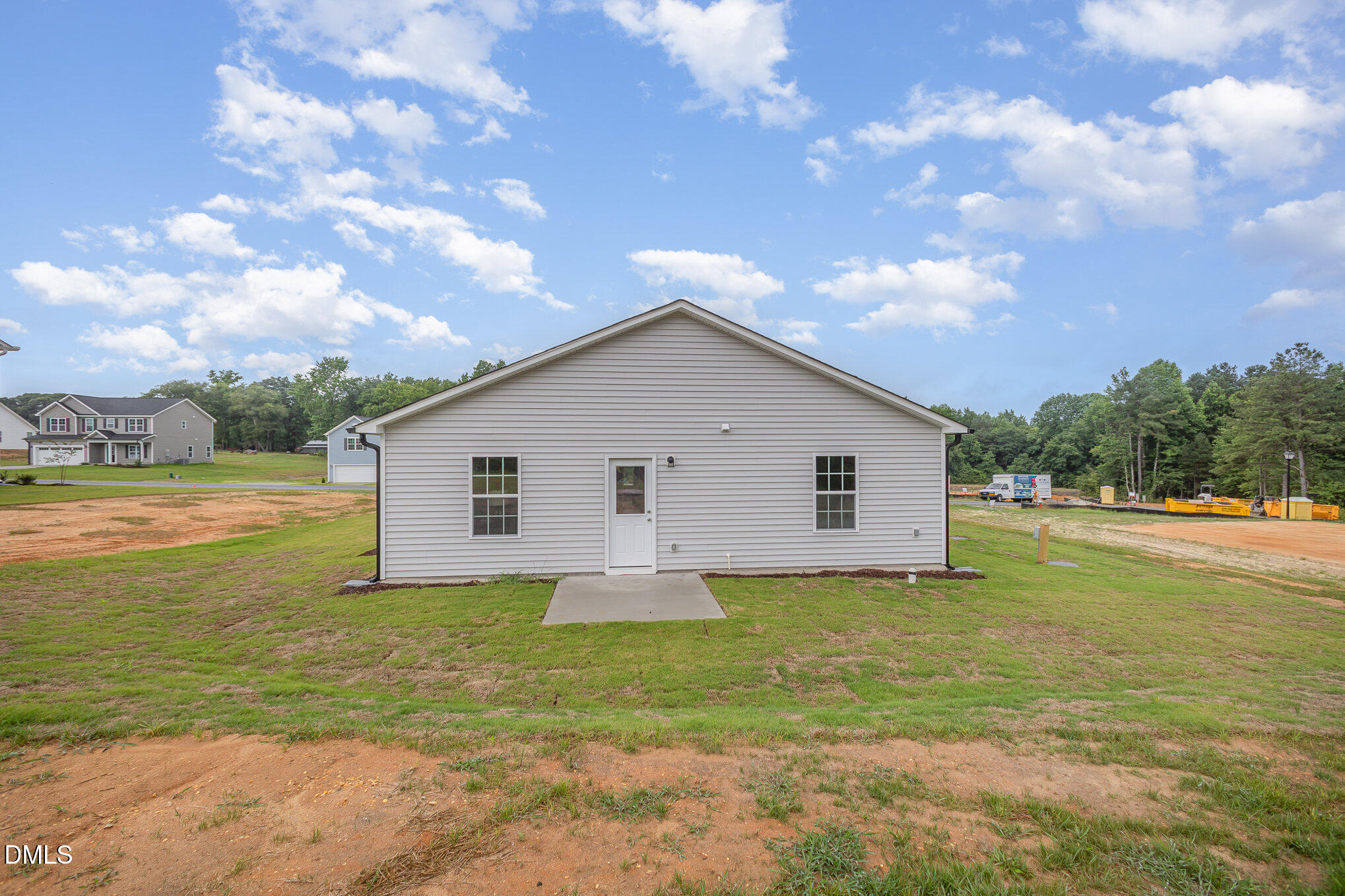 272 Johnson Rdg Way, Unit 1 Four Oaks, NC 27524 - Photo 6 of 27 a view of a house with a yard