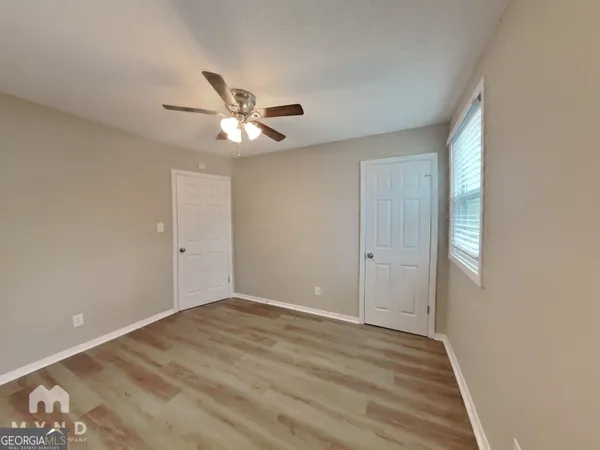 a view of an empty room with a window