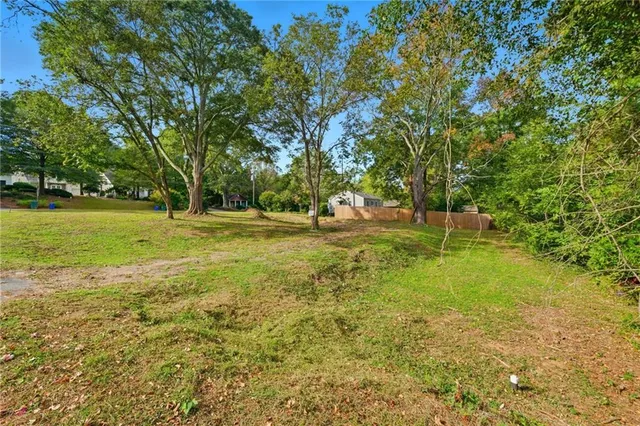 a view of outdoor space with deck and yard