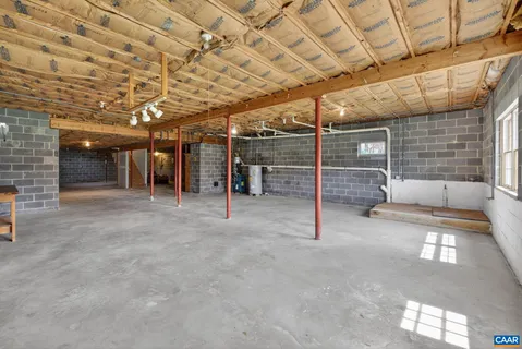 a view of an empty room with wooden walls