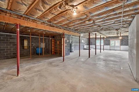 a view of an empty room with wooden roof