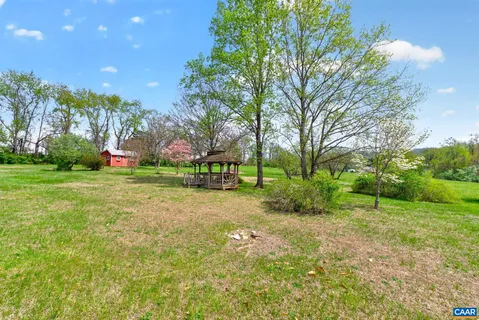 a view of a yard with a fence