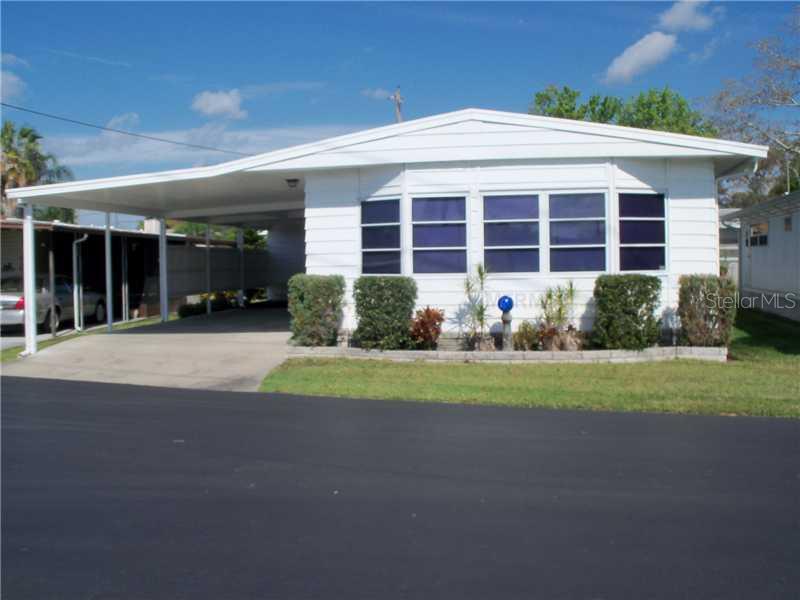 508 5th Street Clearwater, FL 33765 - Photo 1 of 1 a front view of a house with porch and garden