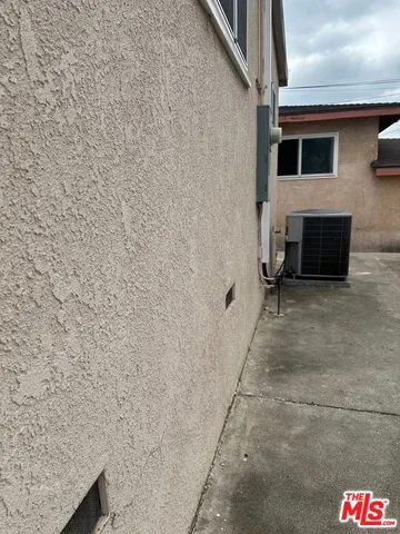 a front view of a house with a rug