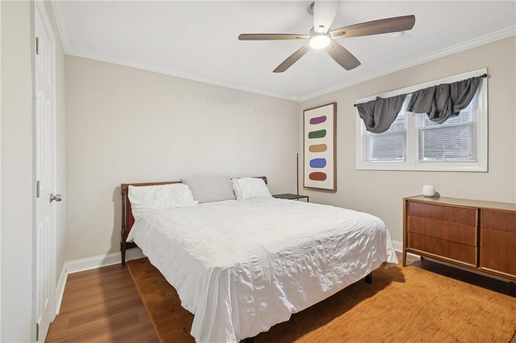 3459 Tulip Drive Decatur, GA 30032 - Photo 14 of 17 a bedroom with a bed and a chandelier