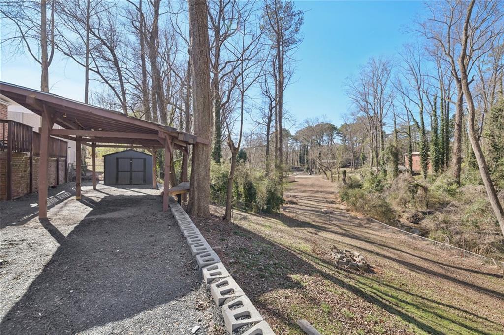 3459 Tulip Drive Decatur, GA 30032 - Photo 16 of 17 a view of a yard with car parked on the road