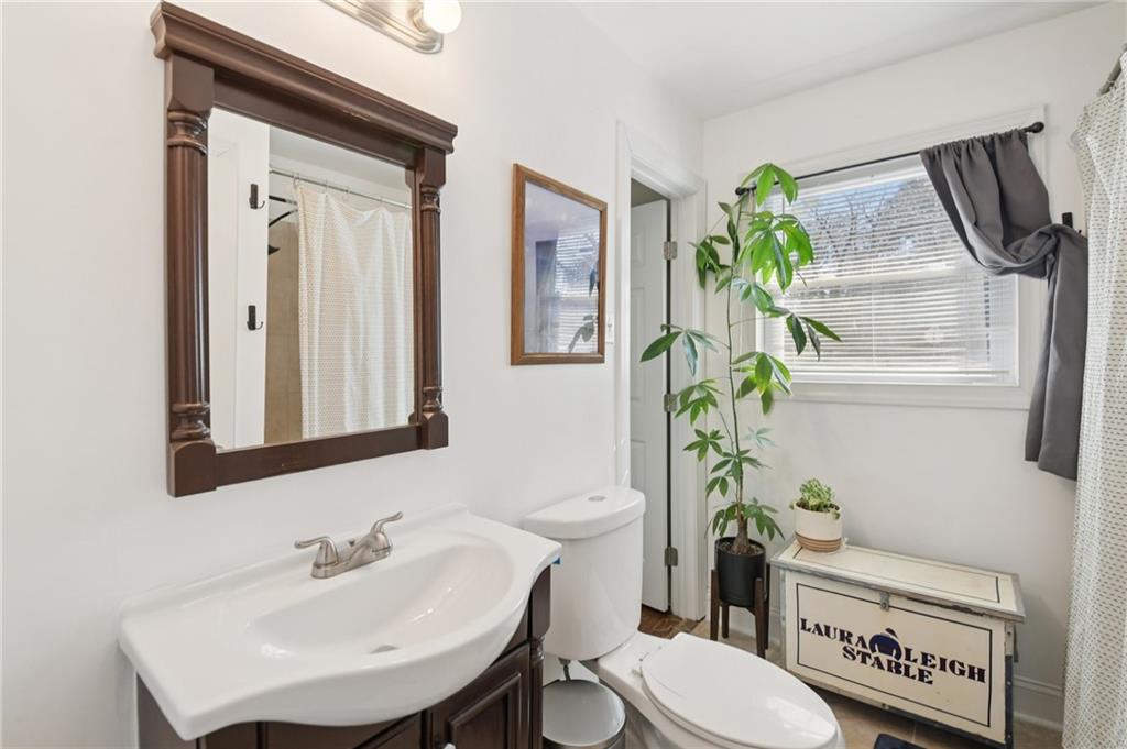 3459 Tulip Drive Decatur, GA 30032 - Photo 9 of 17 a bathroom with a toilet sink and mirror