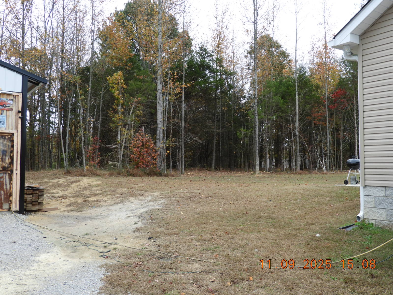 3135 Oak Grove Road Goodspring, TN 38460 - Photo 24 of 62 a backyard of a house with plants and trees