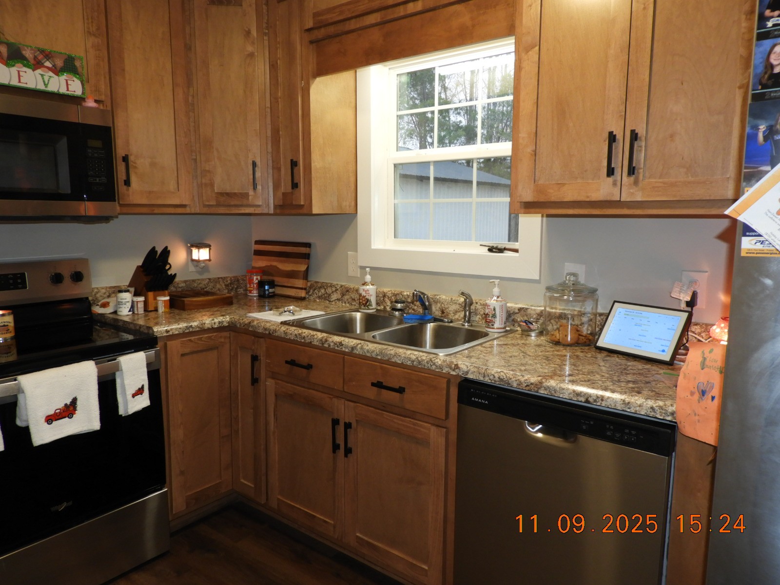 3135 Oak Grove Road Goodspring, TN 38460 - Photo 45 of 62 a kitchen with stainless steel appliances granite countertop a sink stove and microwave