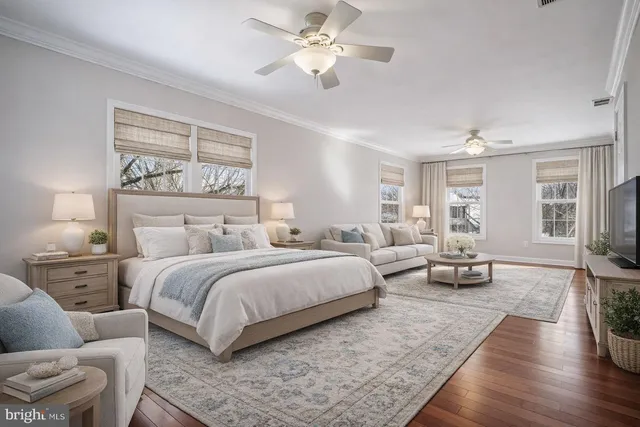 a spacious bedroom with a bed and furniture