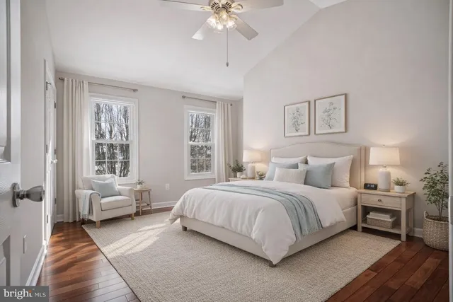 a spacious bedroom with a bed and a couch