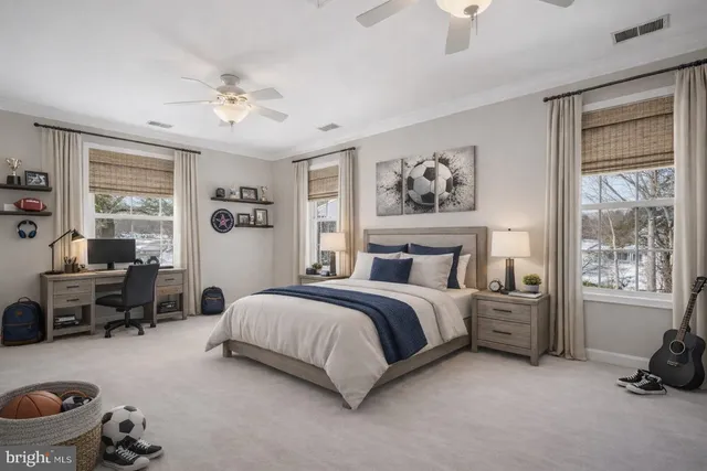 a spacious bedroom with a bed and a window