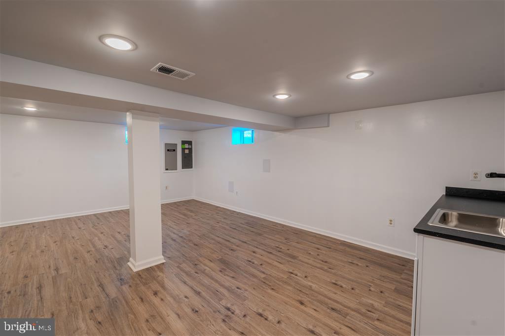 12324 Centerhill Street Silver Spring, MD 20902 - Photo 19 of 24 a view of empty room with wooden floor