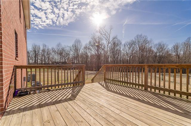 2436 Pleasant View Road Pleasant View, TN 37146 - Photo 9 of 17 Large deck that overlooks the expansive back yard would be perfect for barbeques and family gatherings.