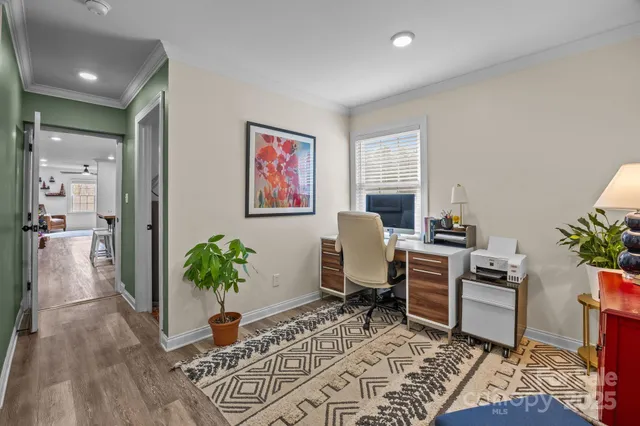 a workspace with furniture window and wooden floor