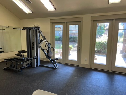 203 Kelly Road, Unit 114 Clemson, SC 29631 - Photo 35 of 37 Double French doors open to the outdoors from this dedicated exercise room.
