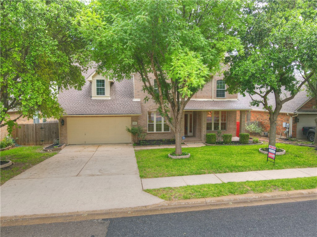 1845 Chasewood Drive Austin, TX 78727 - Photo 1 of 1 a front view of house with yard and green space