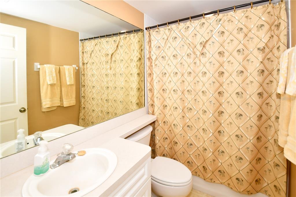 6450 Shoreline Drive, Unit 9405 St. Petersburg, FL 33708 - Photo 24 of 36 a bathroom with a sink and a toilet