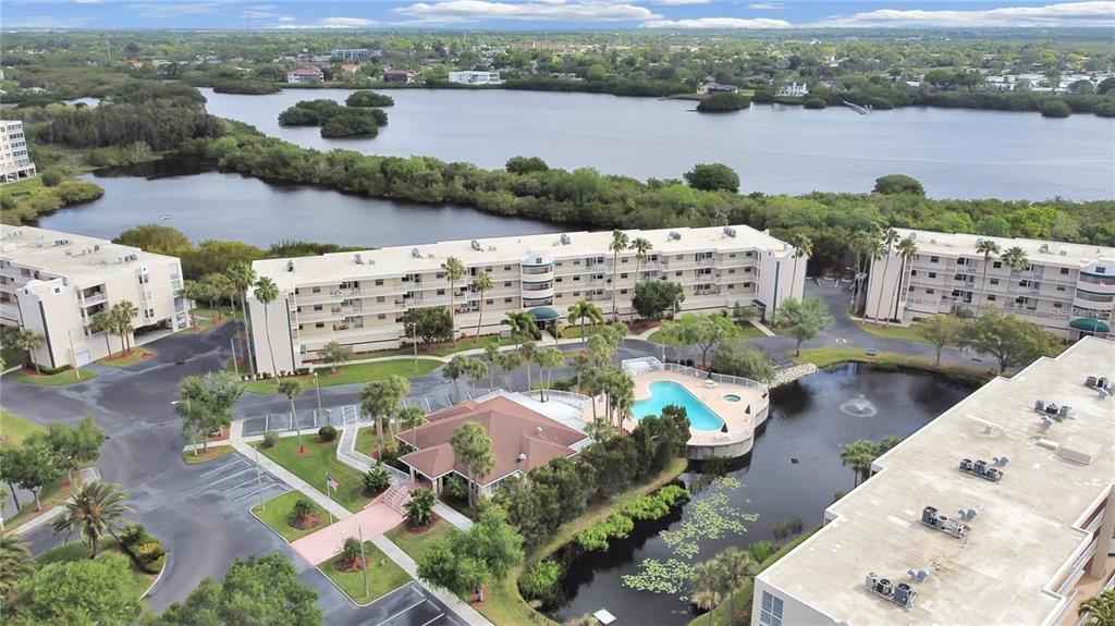 6450 Shoreline Drive, Unit 9405 St. Petersburg, FL 33708 - Photo 32 of 36 an aerial view of lake with residential house with outdoor space