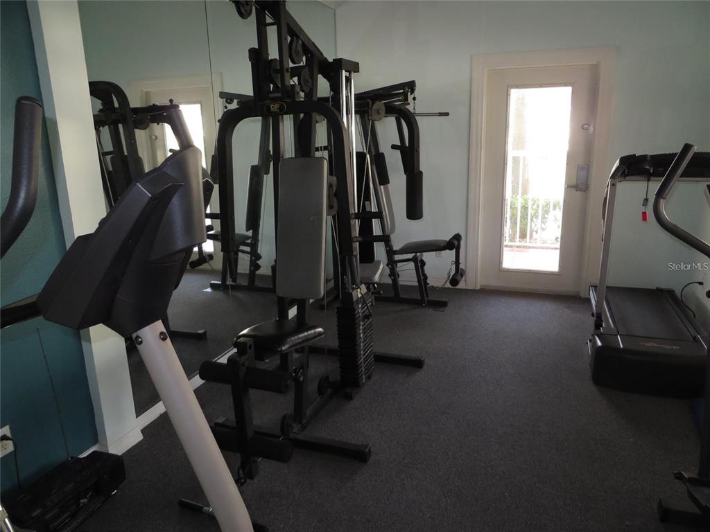 6450 Shoreline Drive, Unit 9405 St. Petersburg, FL 33708 - Photo 34 of 36 a view of a room with gym equipment