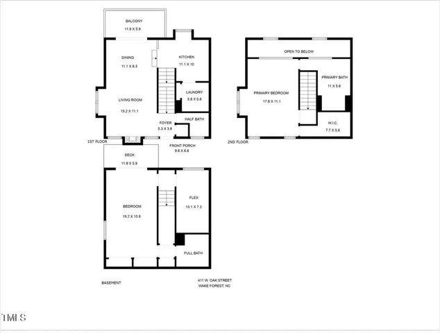 an aerial view of a residential houses with outdoor space and trees all around