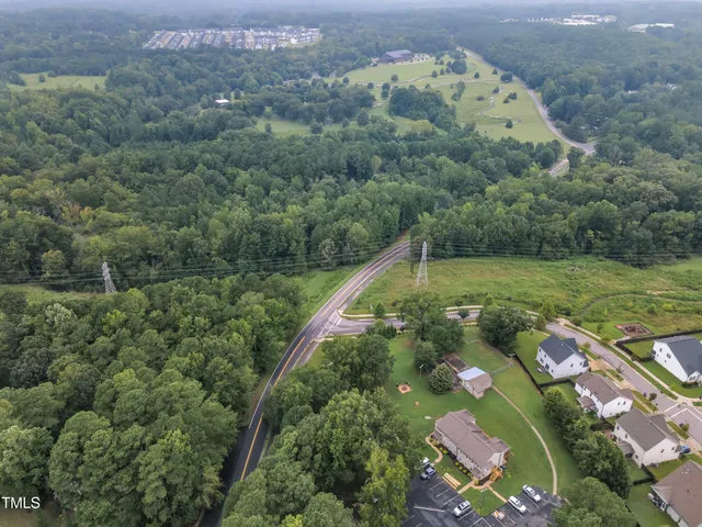 a view of a tree with a yard