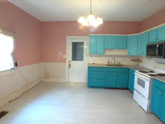 a kitchen with cabinets a sink and dishwasher