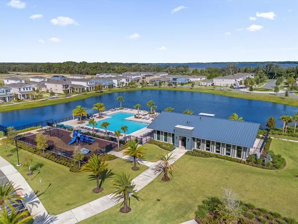 an aerial view of a house with a ocean view