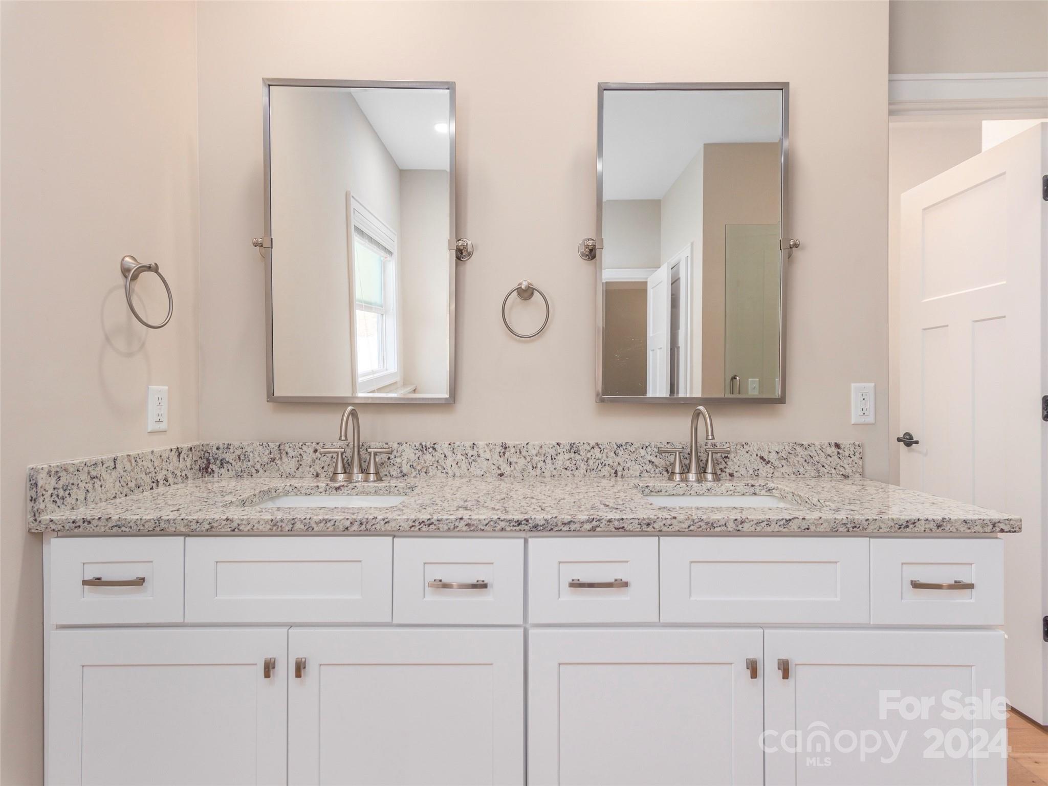 113 Millbrae Loop Hendersonville, NC 28791 - Photo 17 of 35 a bathroom with a granite countertop double vanity sink and a mirror
